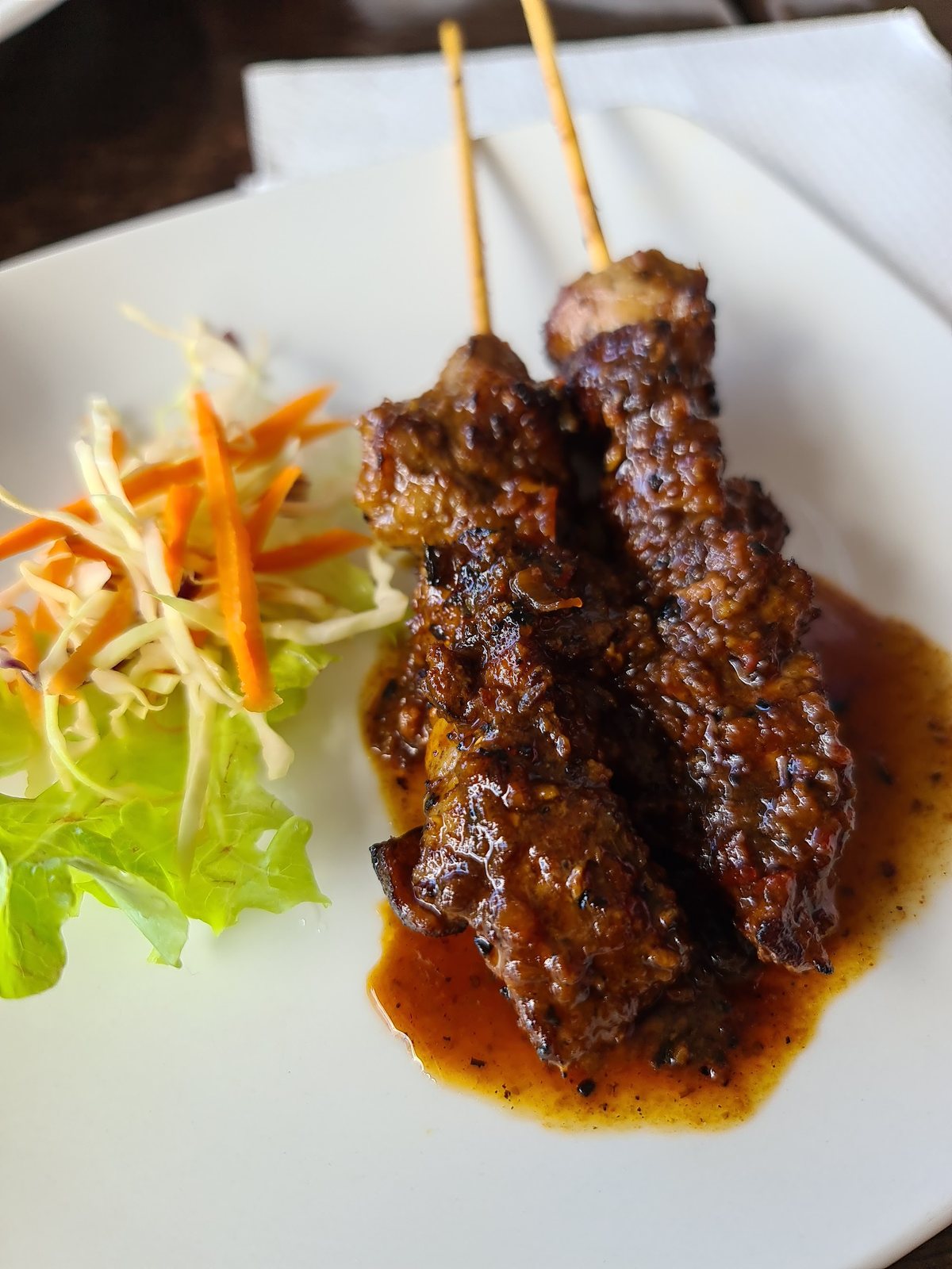 Glazed satay skewers with a fresh slaw